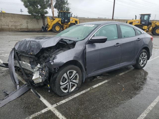 HONDA CIVIC LX 2018 with VIN 2HGFC2F59JH599477 - Photo from auction