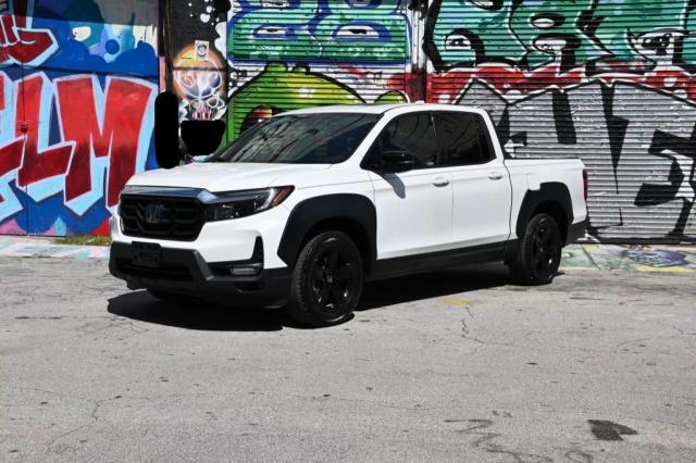 Photo 2 from auction – 2023 HONDA RIDGELINE with VIN 5FPYK3F87PB036086