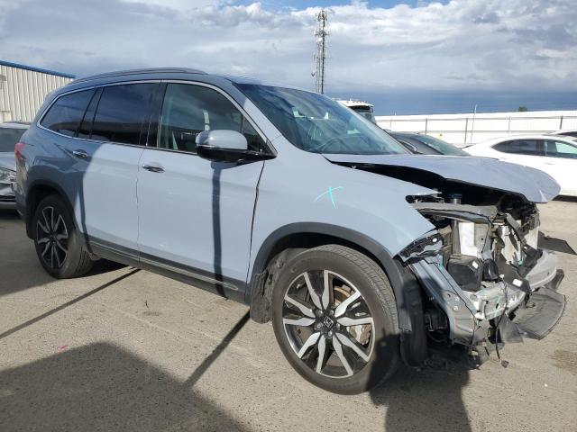 Photo 4 from auction – 2022 HONDA PILOT TOUR with VIN 5FNYF5H93NB015893