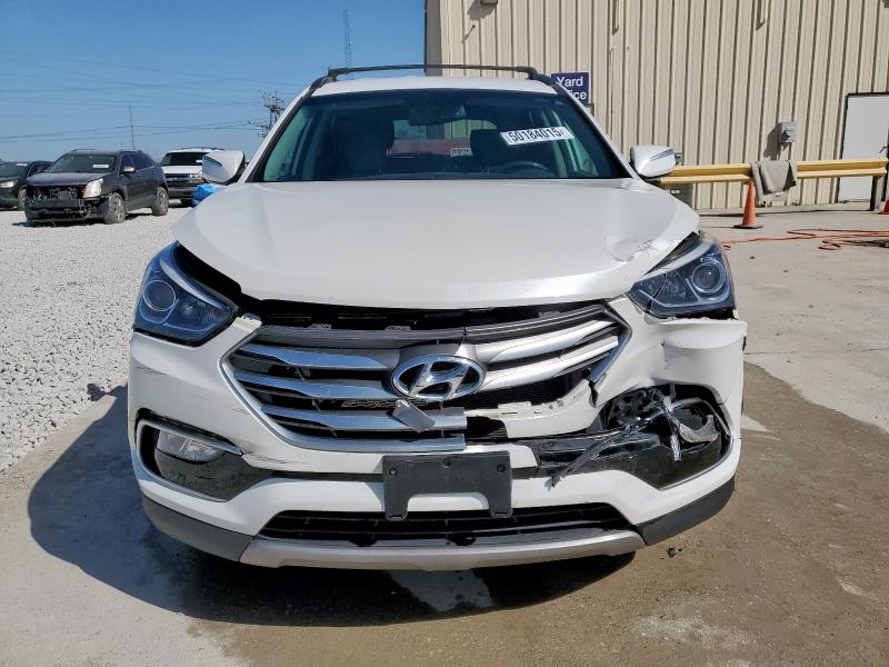 Photo 5 from auction – 2017 HYUNDAI SANTA FE S with VIN 5NMZU3LB5HH047806