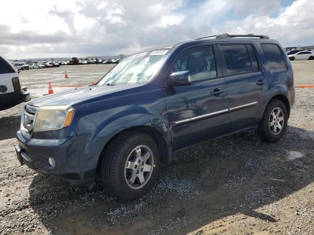 HONDA PILOT TOUR 2011 with VIN 5FNYF4H95BB100952 - Photo from auction