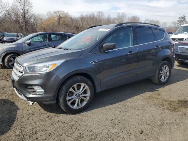 FORD ESCAPE SE 2018 with VIN 1FMCU9GD9JUC98388 - Photo from auction