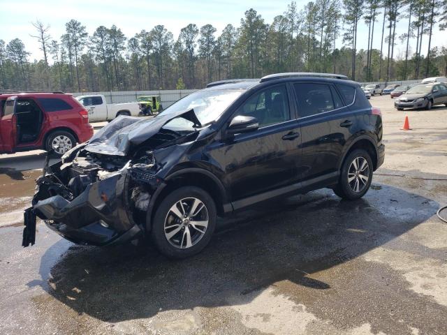 TOYOTA RAV4 XLE 2016 with VIN 2T3WFREV0GW299058 - Photo from auction