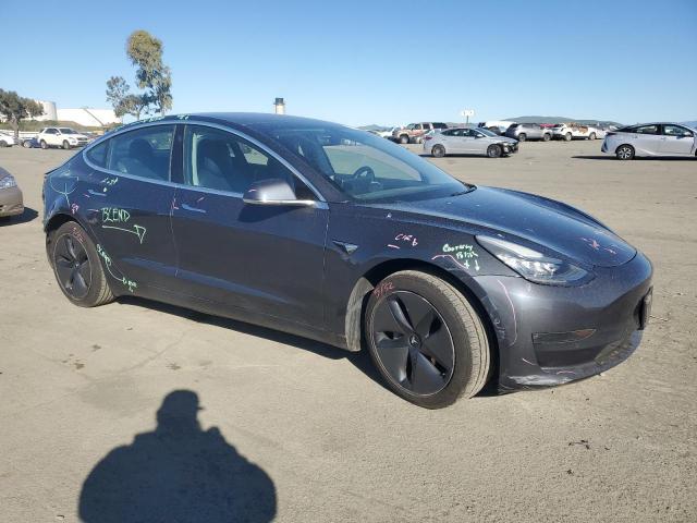Снимка 4 от търг – 2018 TESLA MODEL 3 с VIN 5YJ3E1EB7JF089714