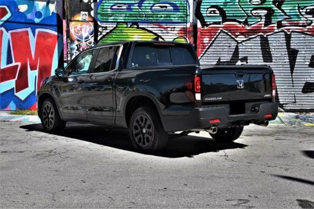 Photo 3 from auction – 2023 HONDA RIDGELINE with VIN 5FPYK3F54PB034057