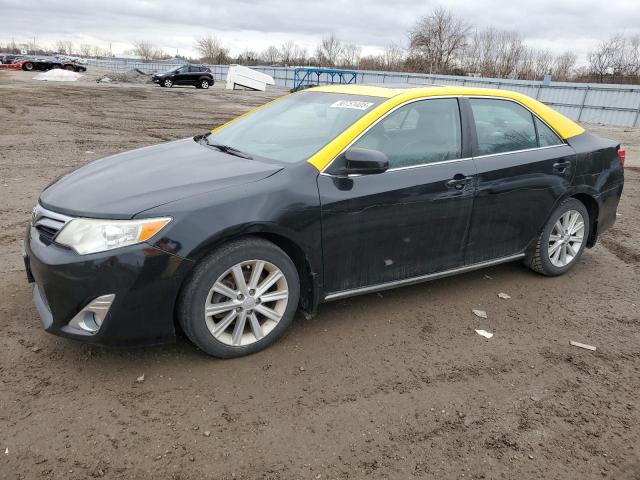 TOYOTA CAMRY HYBR 2014 with VIN 4T1BD1FK0EU112093 - Photo from auction