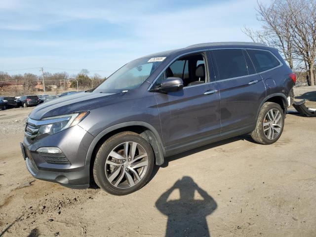 HONDA PILOT TOUR 2018 with VIN 5FNYF5H93JB005665 - Photo from auction