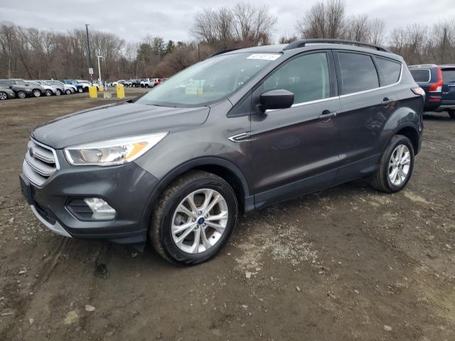 FORD ESCAPE SE 2018 with VIN 1FMCU9GD8JUB76153 - Photo from auction