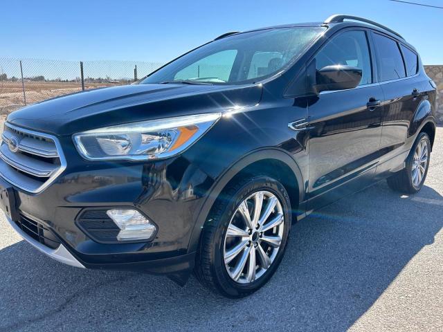 Photo 2 from auction – 2018 FORD ESCAPE SE with VIN 1FMCU9GD7JUA39057