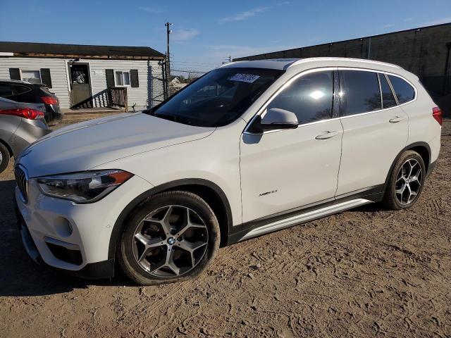 BMW X1 XDRIVE2 2017 with VIN WBXHT3C32H5F77716 - Photo from auction