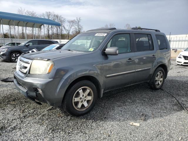 HONDA PILOT TOUR 2010 with VIN 5FNYF3H95AB003016 - Photo from auction