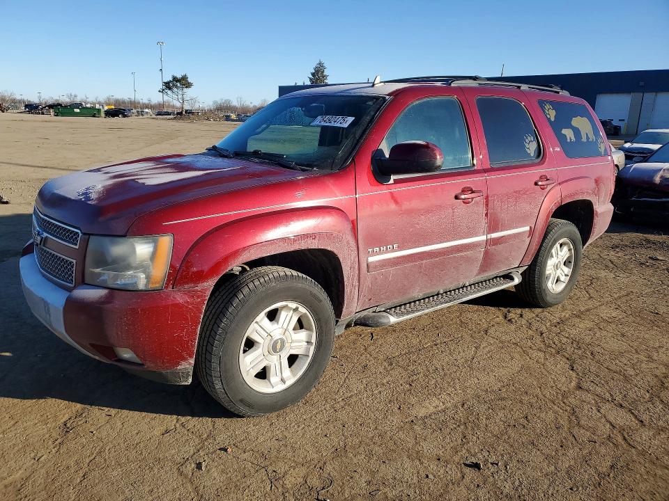 CHEVROLET TAHOE 2011 with VIN 1GNSKBE03BR250281 - Photo from auction