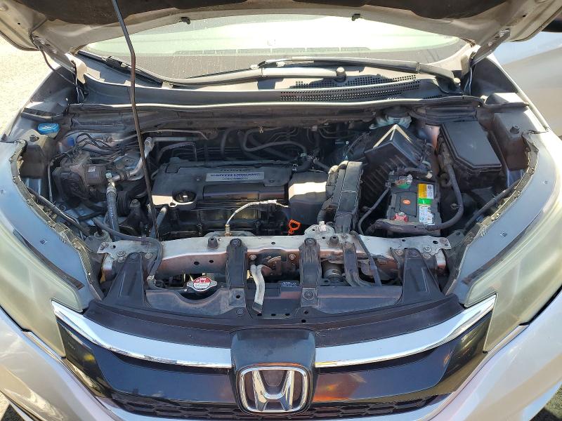 Photo 12 from auction – 2015 HONDA CR-V with VIN 3CZRM3H34FG701814