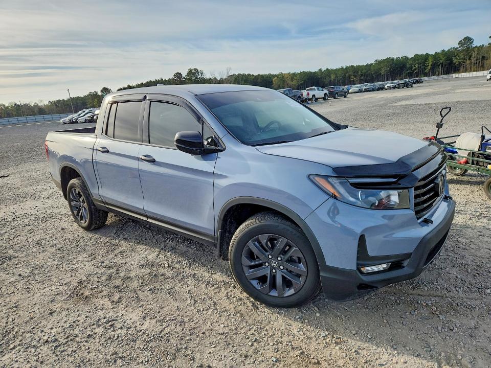 Photo 4 from auction – 2022 HONDA RIDGELINE with VIN 5FPYK3F16NB015732