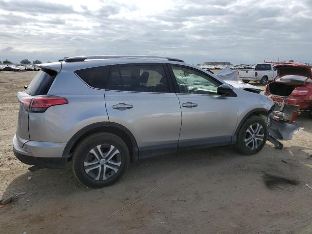 Photo 3 from auction – 2018 TOYOTA RAV4 LE with VIN JTMZFREV6JJ164556