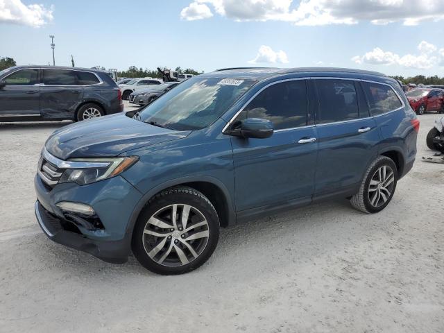 HONDA PILOT TOUR 2017 with VIN 5FNYF5H92HB020233 - Photo from auction