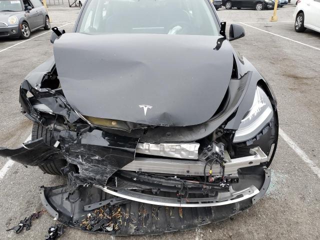 Photo 11 from auction – 2022 TESLA MODEL Y with VIN 7SAYGDEE9NF351852