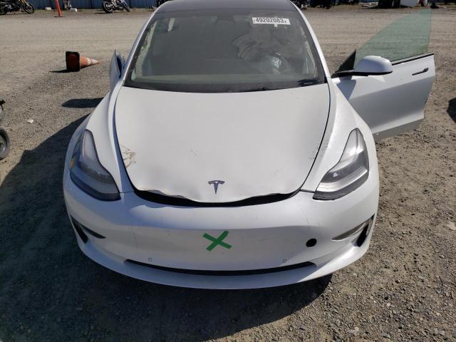 Photo 11 from auction – 2022 TESLA MODEL 3 with VIN 5YJ3E1EB5NF163556
