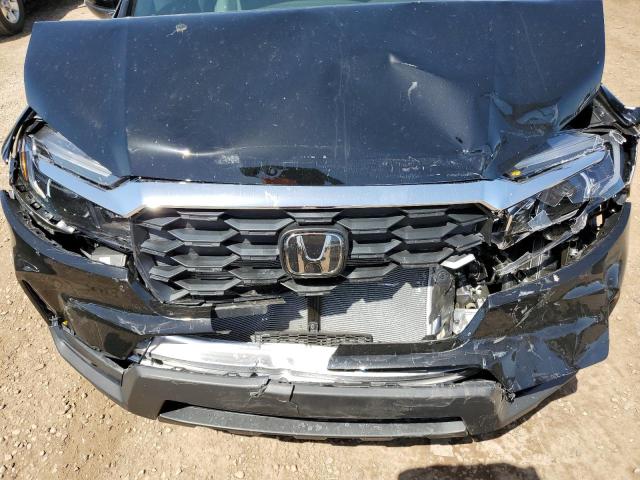 Photo 12 from auction – 2023 HONDA PASSPORT E with VIN 5FNYF8H53PB013983
