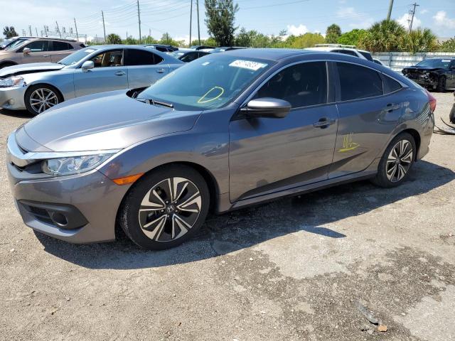 HONDA CIVIC EX 2018 with VIN JHMFC1F32JX031153 - Photo from auction