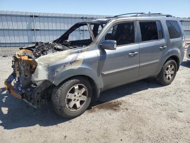 HONDA PILOT TOUR 2011 with VIN 5FNYF4H97BB102010 - Photo from auction