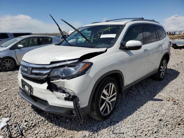 HONDA PILOT TOUR 2017 with VIN 5FNYF6H98HB076408 - Photo from auction