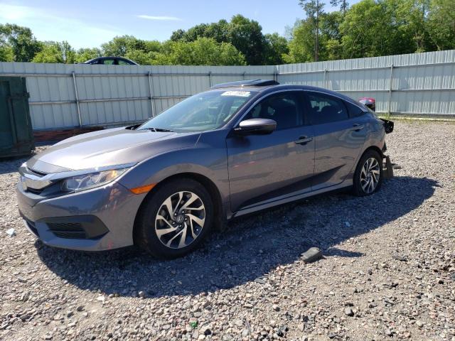 HONDA CIVIC EX 2018 with VIN 19XFC2F70JE027273 - Photo from auction