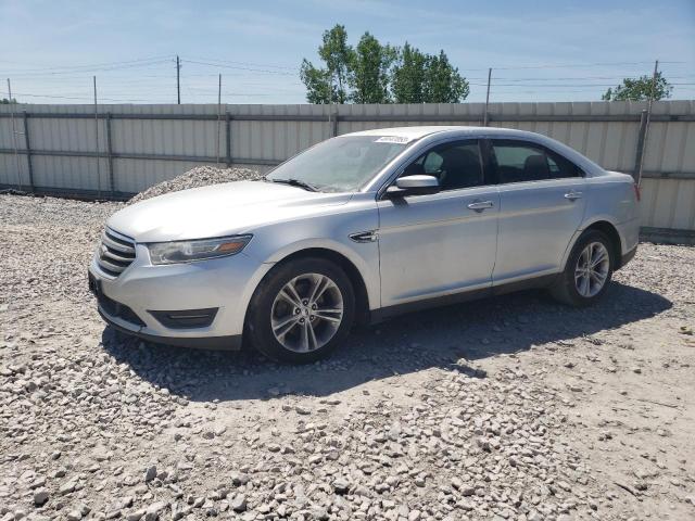 FORD TAURUS SEL 2013 with VIN 1FAHP2E8XDG141153 - Photo from auction