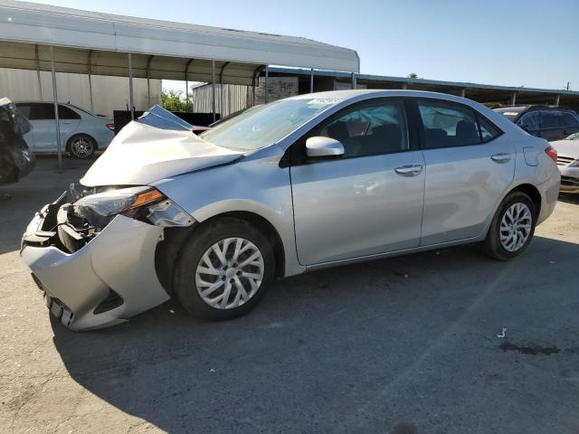 TOYOTA COROLLA L 2019 with VIN 5YFBURHE8KP889785 - Photo from auction