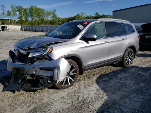 HONDA PILOT TOUR 2019 with VIN 5FNYF5H93KB019972 - Photo from auction