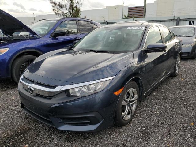 HONDA CIVIC LX 2018 with VIN 19XFC2F56JE033352 - Photo from auction
