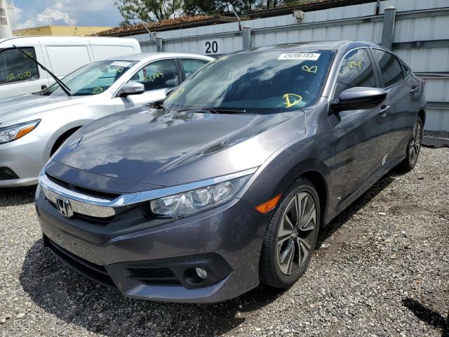 HONDA CIVIC EX 2018 with VIN JHMFC1F34JX006237 - Photo from auction