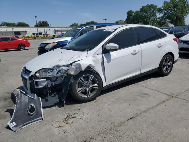 FORD FOCUS SE 2014 with VIN 1FADP3F24EL442072 - Photo from auction