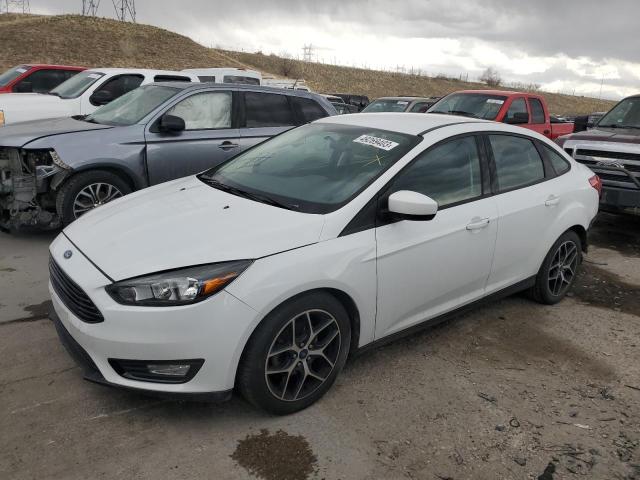 FORD FOCUS SE 2018 with VIN 1FADP3FEXJL235447 - Photo from auction