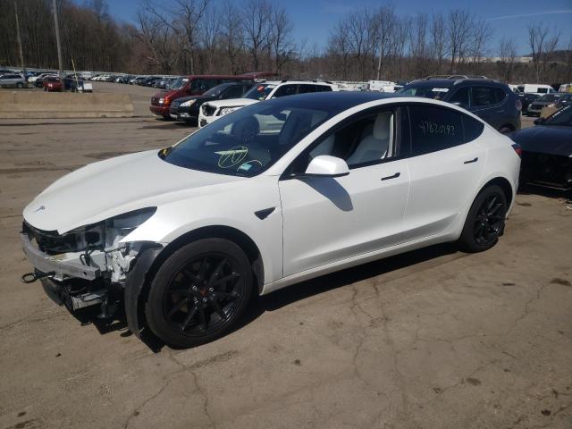 TESLA MODEL 3 2021 with VIN 5YJ3E1EB9MF035741 - Photo from auction