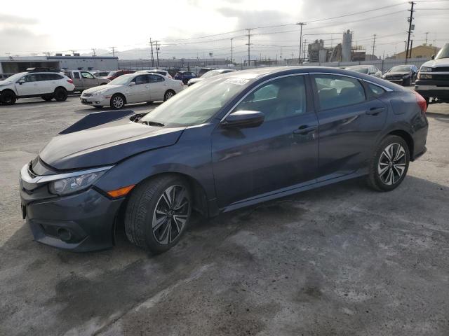 Photo 1 from auction – 2018 HONDA CIVIC EX with VIN 19XFC1F30JE201138