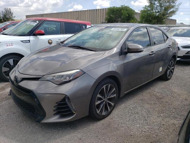 TOYOTA COROLLA L 2018 with VIN 5YFBURHE5JP795099 - Photo from auction