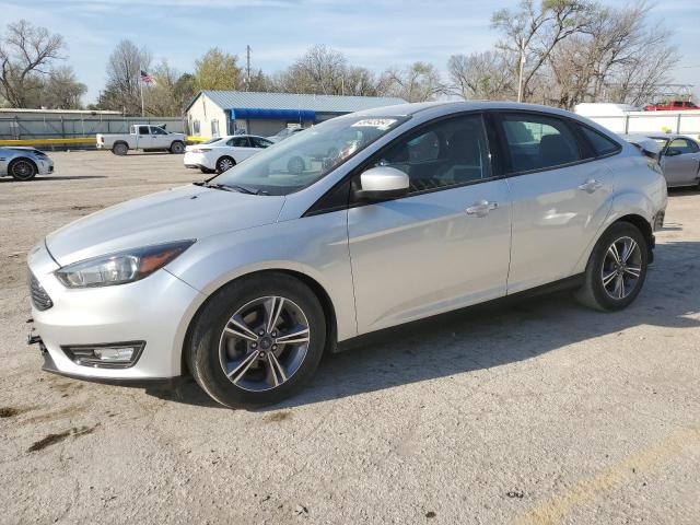 FORD FOCUS SE 2018 with VIN 1FADP3F27JL303497 - Photo from auction