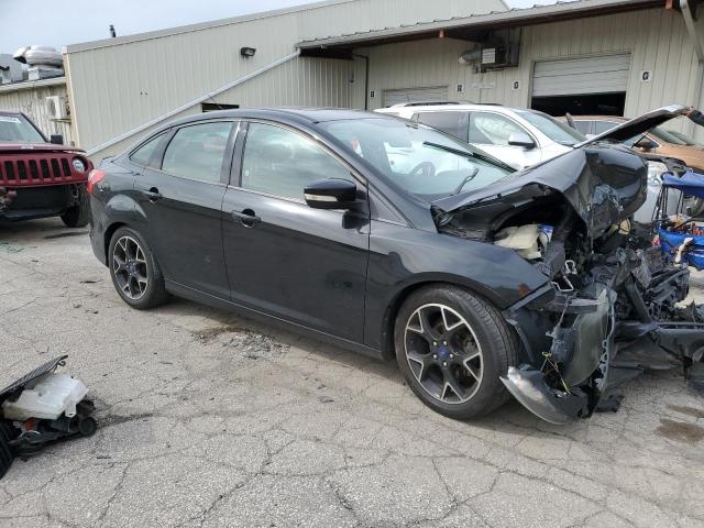 Foto 4 de la subasta – 2014 FORD FOCUS SE con VIN 1FADP3F27EL142557