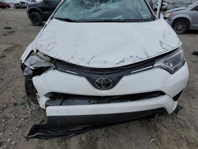 Photo 11 from auction – 2018 TOYOTA RAV4 LE with VIN JTMBFREV5JJ214171