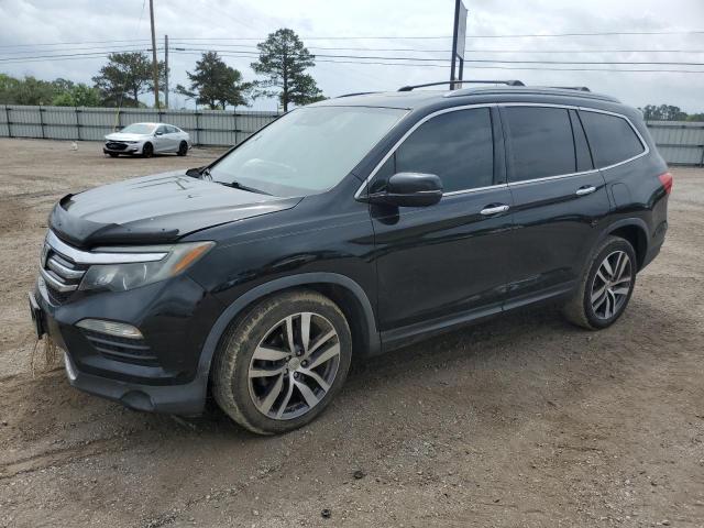 HONDA PILOT TOUR 2017 with VIN 5FNYF5H94HB004907 - Photo from auction