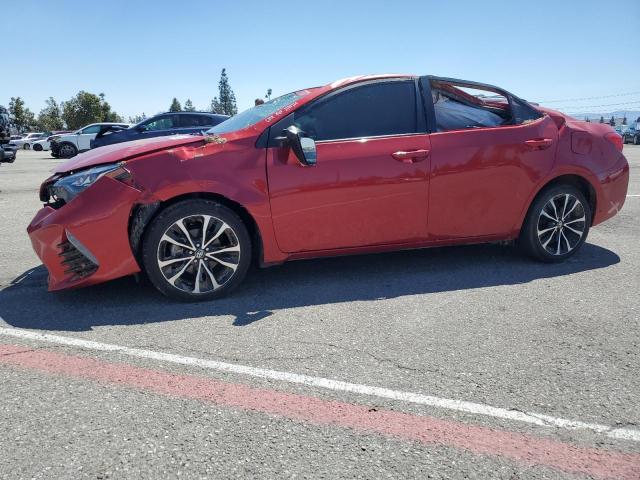 TOYOTA COROLLA L 2018 with VIN 5YFBURHE5JP779551 - Photo from auction