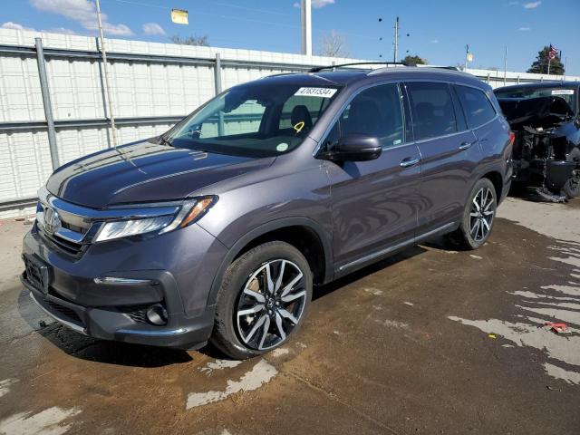 HONDA PILOT TOUR 2022 with VIN 5FNYF6H69NB017627 - Photo from auction