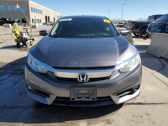 Photo 5 from auction – 2018 HONDA CIVIC EX with VIN 19XFC1E37JE003643
