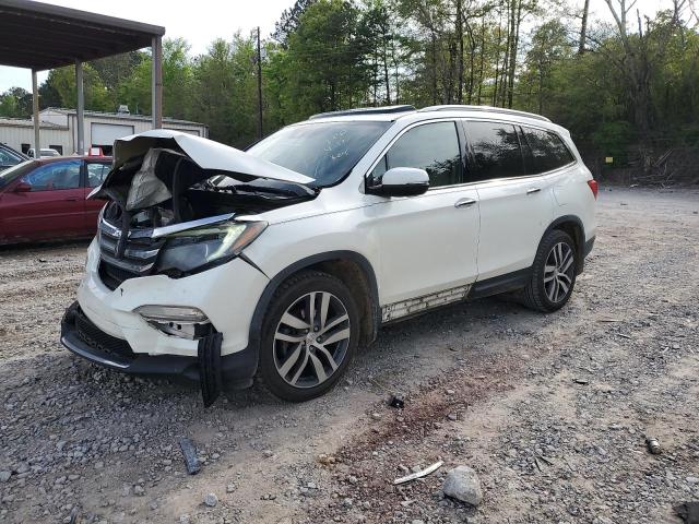 HONDA PILOT TOUR 2016 with VIN 5FNYF5H94GB017557 - Photo from auction