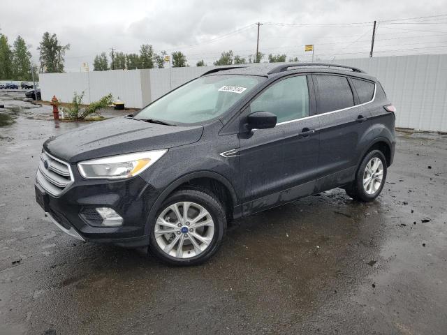 FORD ESCAPE SE 2018 with VIN 1FMCU9GD6JUB15691 - Photo from auction