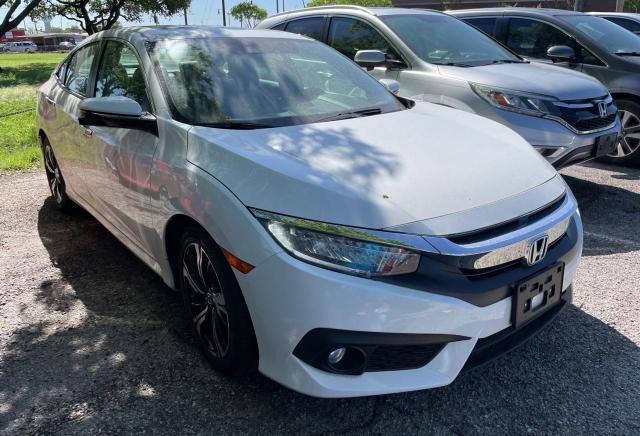 HONDA CIVIC TOUR 2017 with VIN 19XFC1F92HE027166 - Photo from auction