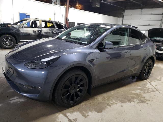 TESLA MODEL Y 2023 with VIN 7SAYGDEE6PF698980 - Photo from auction