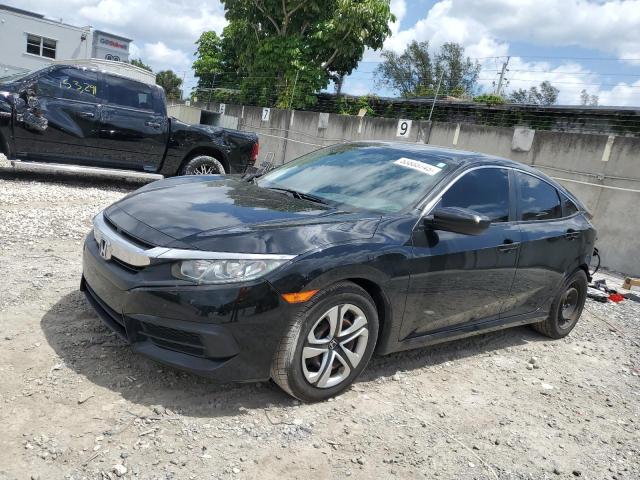 HONDA CIVIC LX 2018 with VIN 19XFC2F59JE036987 - Photo from auction
