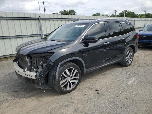 HONDA PILOT TOUR 2017 with VIN 5FNYF5H9XHB007522 - Photo from auction